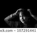 A beautiful young woman posing for portraits 107291441