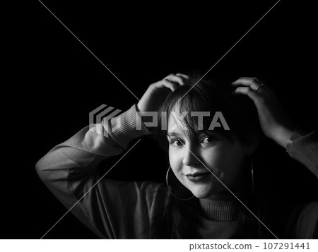 A beautiful young woman posing for portraits A beautiful young woman posing for portraits 107291441