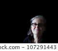 A beautiful middle aged lady posing for the camera 107291443