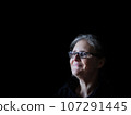 A beautiful middle aged lady posing for the camera 107291445