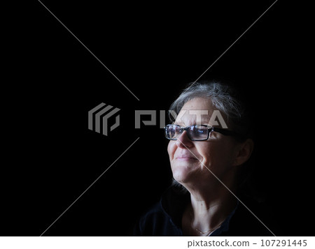 A beautiful middle aged lady posing for the camera A beautiful middle aged lady posing for the camera 107291445