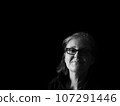 A beautiful middle aged lady posing for the camera 107291446