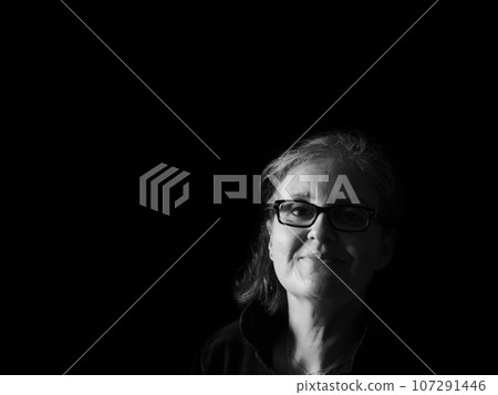 A beautiful middle aged lady posing for the camera A beautiful middle aged lady posing for the camera 107291446