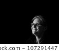 A beautiful middle aged lady posing for the camera 107291447