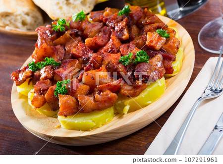 Spanish dish - roasted pig nose and cheeks 107291961