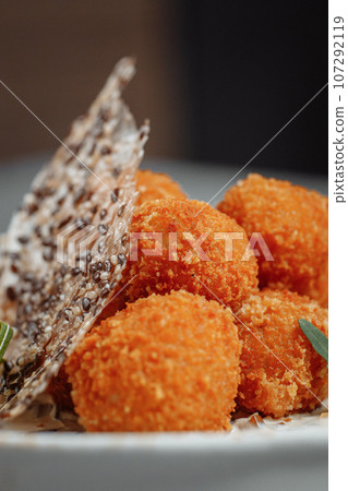 Potato croquettes - mashed potatoes balls breaded and deep fried, served with different sauce. Potato croquettes - mashed potatoes balls breaded and deep fried, served with different sauce. 107292119