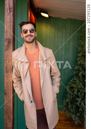 Handsome man in coat outside at winter Handsome man in coat outside at winter 107293126