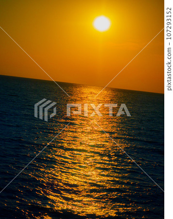 Sunset on the sea. Reflection of the sun on the surface of the sea. Background. Sunset on the sea. Reflection of the sun on the surface of the sea. Background. 107293152