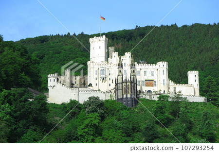 From the sightseeing boat down the Rhine: Stolzenfels Castle (front) stands out against the green mountain surface 107293254