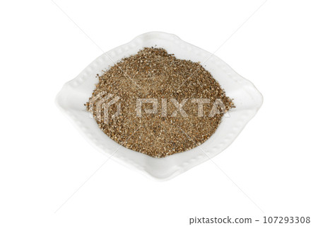 Black ground pepper isolated on white background. 107293308