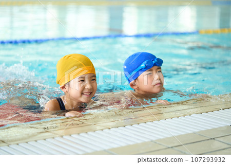 child flopping by the pool 107293932