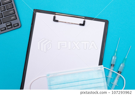 Vaccination or Revaccination Concept - Two Medical Syringe on Blue Table Vaccination or Revaccination Concept - Two Medical Syringe on Blue Table 107293962