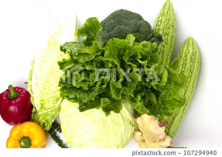 Vegetarian and vegan healthy lifestyle concept. Raw vegetables and fruits with empty plate over rustic background 107294940