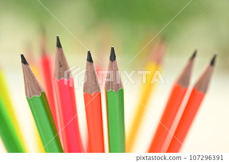 group of colourful sharp pencil on blur green nature background with bokeh 107296391