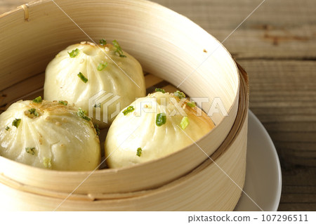Xiaolongbao steamed in a steamer 107296511