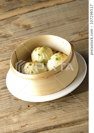 Xiaolongbao steamed in a steamer 107296517