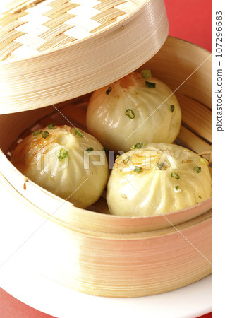 Xiaolongbao steamed in a steamer 107296683