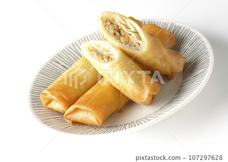 A type of dim sum spring roll photographed against a white background 107297628
