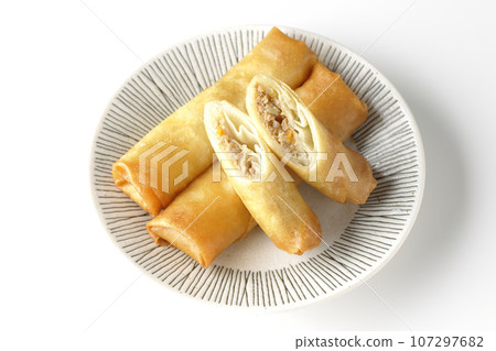 An overhead shot of a type of dim sum spring roll against a white background 107297682