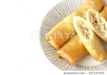 An overhead shot of a type of dim sum spring roll against a white background 107297693