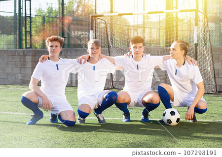 Portrait Of male high school soccer team on field Portrait Of male high school soccer team on field 107298191