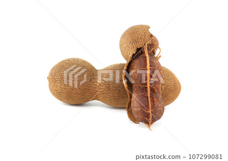 Group of tamarind fruits pods over white background 107299081