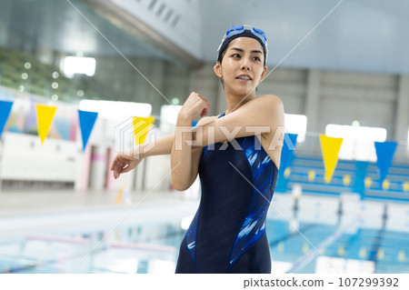 Woman swimming in the pool 107299392