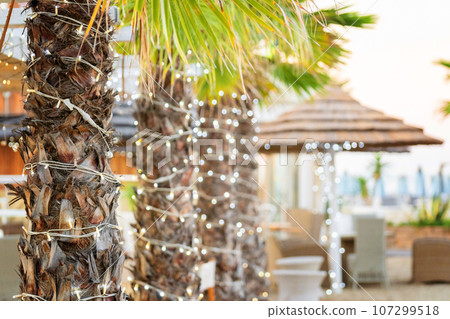 Parasol umbrella on tropical island beach. Colourful sunshade in the beach on sunny summer day. Holiday relaxation with turquoise sea and blue sky landscape Parasol umbrella on tropical island beach. Colourful sunshade in the beach on sunny summer day. Holiday relaxation with turquoise sea and blue sky landscape 107299518