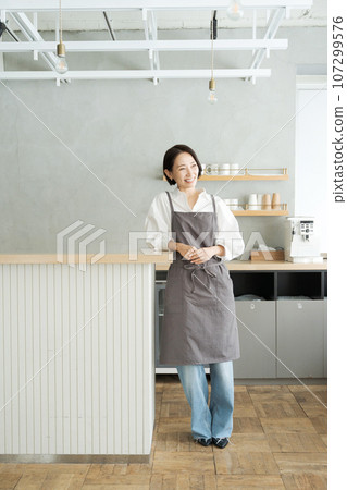 Photo of cafe staff standing in the kitchen Photo of cafe staff standing in the kitchen 107299576