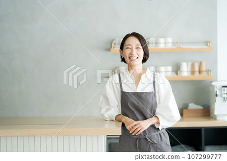 Photo of cafe staff standing in the kitchen Photo of cafe staff standing in the kitchen 107299777