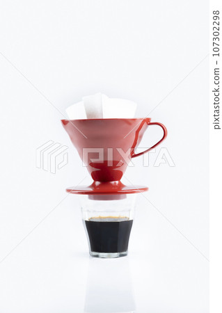 Cup of coffee with a V60 dripper coffee maker 107302298