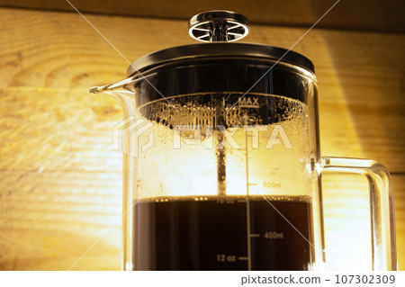 Fresh coffee in a French press coffee maker 107302309