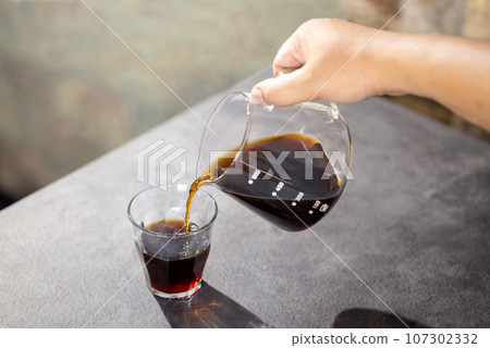 A cup of hot coffee 107302332