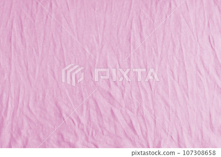 Wrinkled, crumpled pink jersey fabric texture background Wrinkled, crumpled pink jersey fabric texture background 107308658
