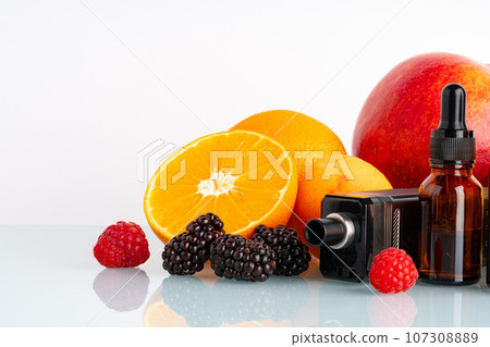 Vape and smoking liquid with fruit flavor on white background 107308889