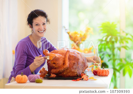 Family cooking Thanksgiving dinner 107309393