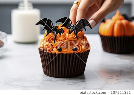 Halloween cupcake with bat topping 107311551