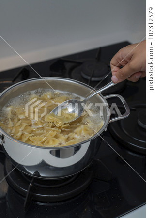 Top view of Pasta boiling in a pot 107312579