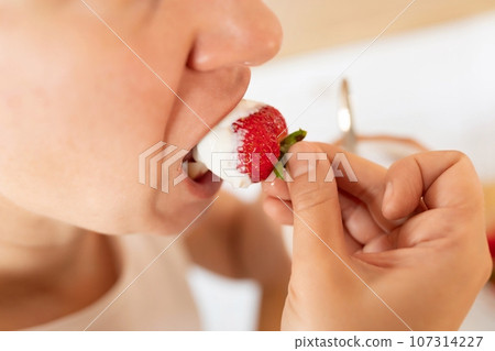 woman having breakfast while dieting in the kitchen woman having breakfast while dieting in the kitchen 107314227