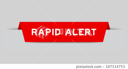 Red color inserted label with word rapid alert on gray background 107314753