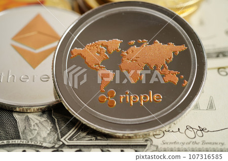 Golden bitcoin on US dollar banknotes money for business and commercial, Digital currency, Virtual cryptocurrency, blockchain technology. Golden bitcoin on US dollar banknotes money for business and commercial, Digital currency, Virtual cryptocurrency, blockchain technology. 107316585
