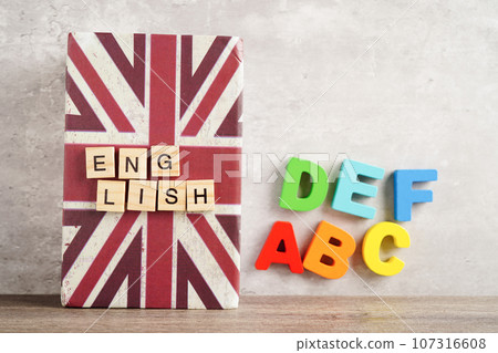 English book with graduate hat, learning and tutorial for foreigner. English book with graduate hat, learning and tutorial for foreigner. 107316608