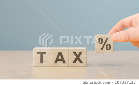 tax percent on wooden cubes. taxes paid by individuals and corporations such as VAT, income tax and property tax. Financial research,government taxes and calculation tax return concept tax percent on wooden cubes. taxes paid by individuals and corporations such as VAT, income tax and property tax. Financial research,government taxes and calculation tax return concept 107317123