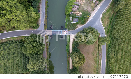 Scenic Aerial View of Canal Drawbridge Amidst Nature Scenic Aerial View of Canal Drawbridge Amidst Nature 107317970