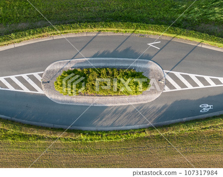 Unusual Split: Countryside Road Curiously Divided Amidst Fields Unusual Split: Countryside Road Curiously Divided Amidst Fields 107317984