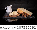 Ingredients cheese and bread for Fonduta, Piedmontese Fondue 107318392