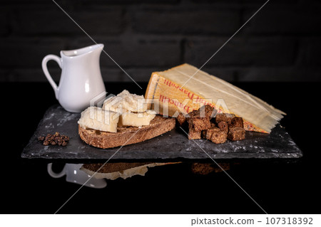 Ingredients cheese and bread for Fonduta, Piedmontese Fondue 107318392