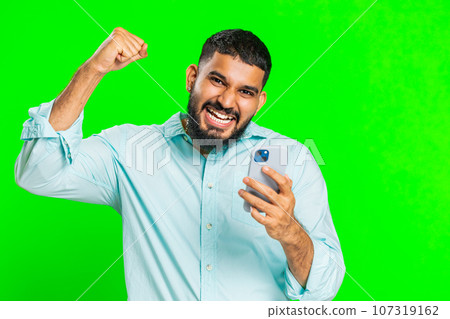 Happy excited winner man use smartphone celebrating success, winning play game, good lottery news 107319162