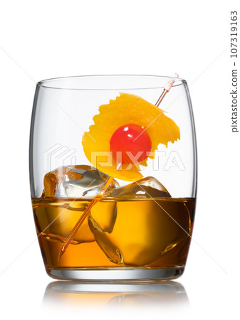 Old fashioned cocktail and pick cherry and orange peel on white. Old fashioned cocktail and pick cherry and orange peel on white. 107319163