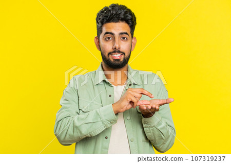 Man show a little bit gesture, begging help, need some more, please give me measuring small size 107319237